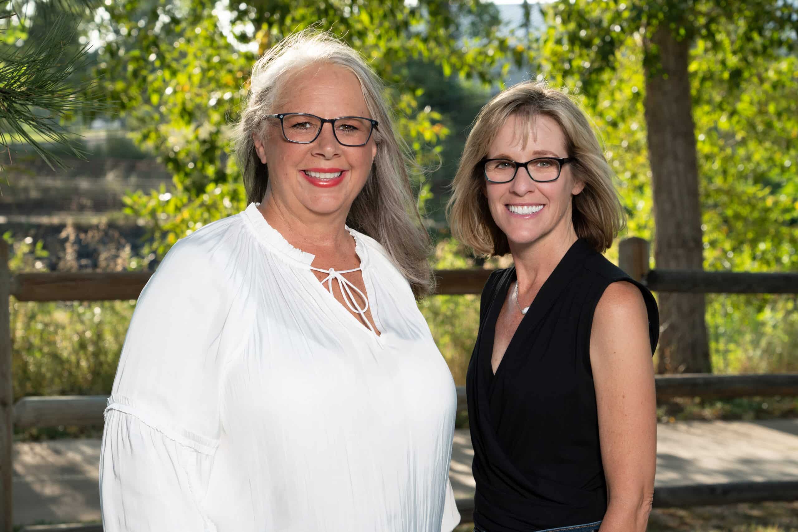 Two women smiling for photo - Cosmetic smile enhancements Littleton