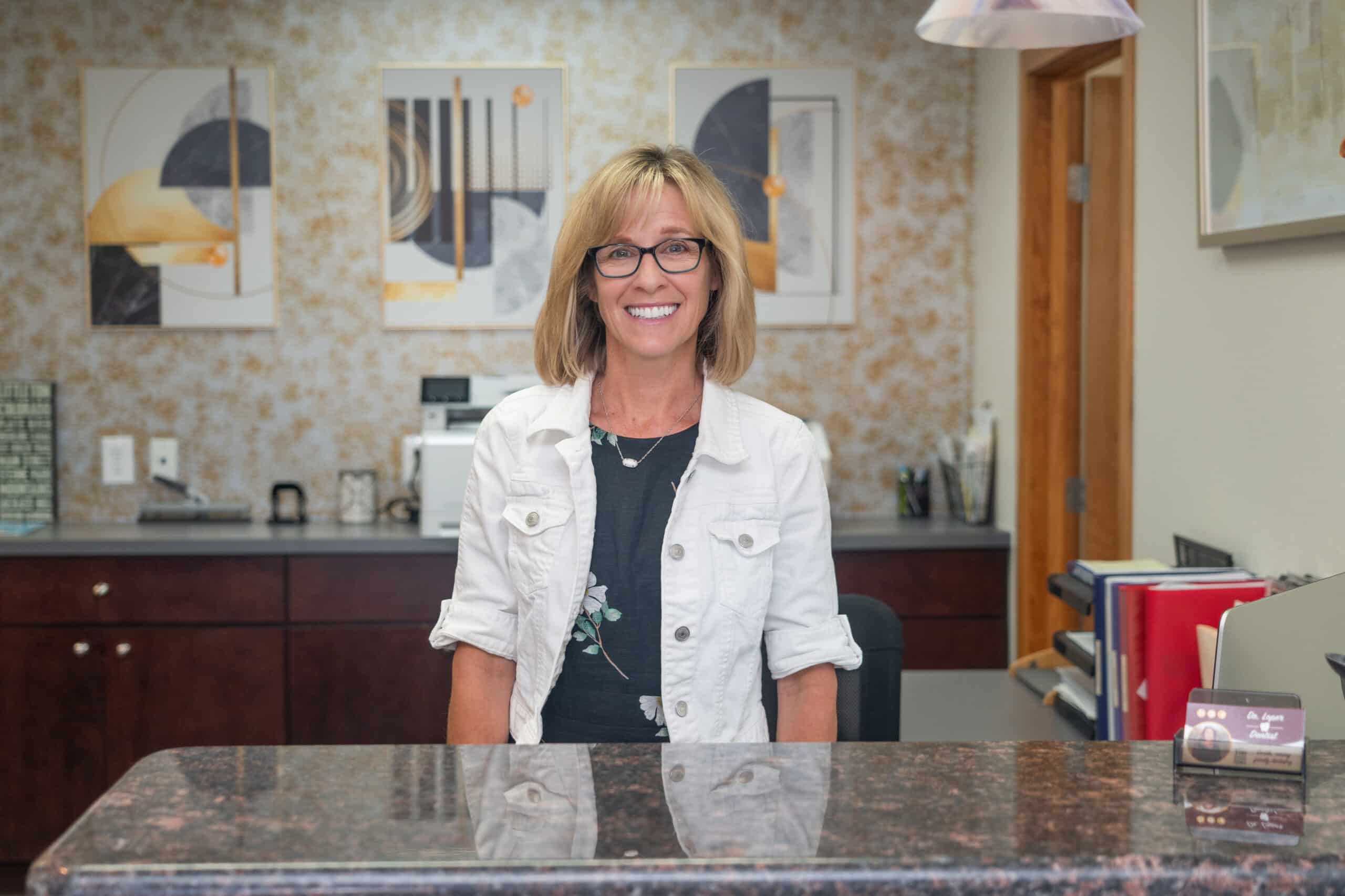 Front desk staff member welcoming patients - Dental Clinic in Littleton, CO