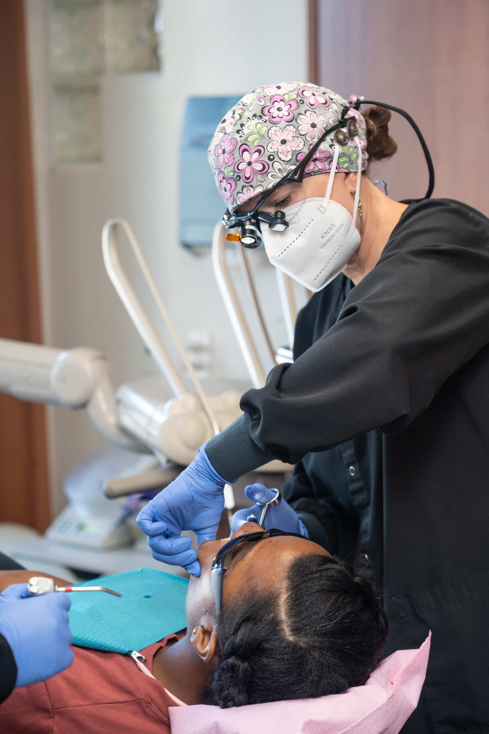 Dental hygienist performing cleaning - Routine Dental Cleanings in Littleton, CO